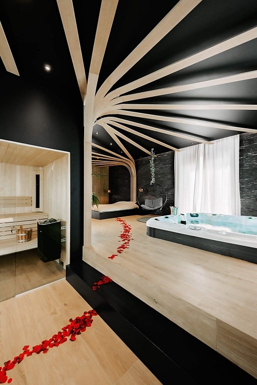 Spa jacuzzi 6 places haut de gamme, gris anthracite, sièges ergonomiques, jets hydromassants pour relaxation optimale.6 de Spa Ebène
